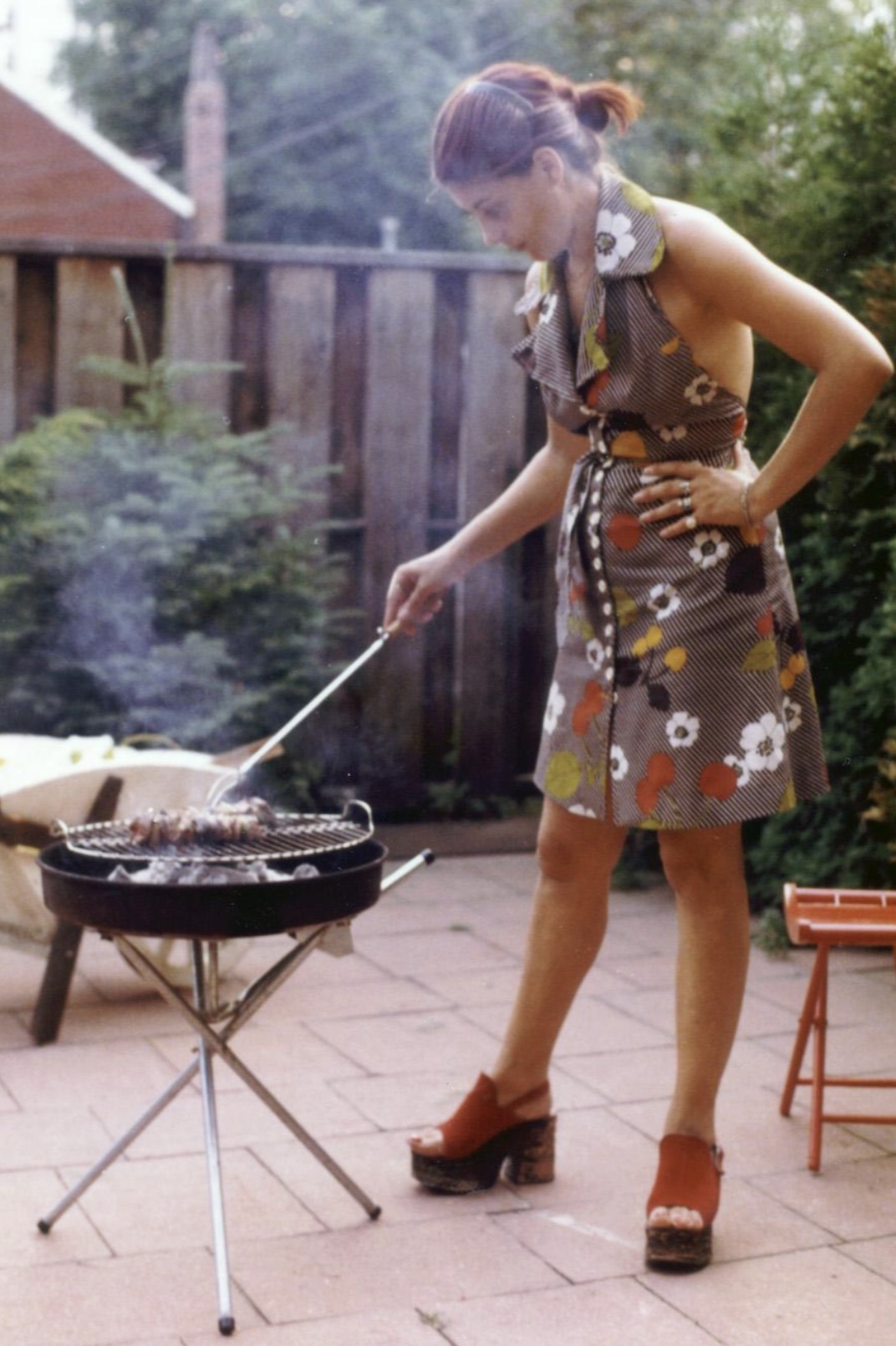 July 1973: A mother cooking out in Toronto, Ontario, Canada. 